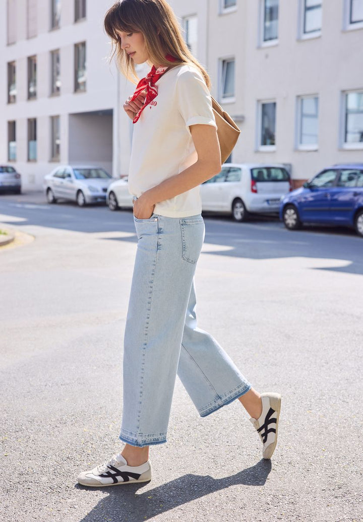Mid Waist Wide Leg Jeans mit Ziersaum
